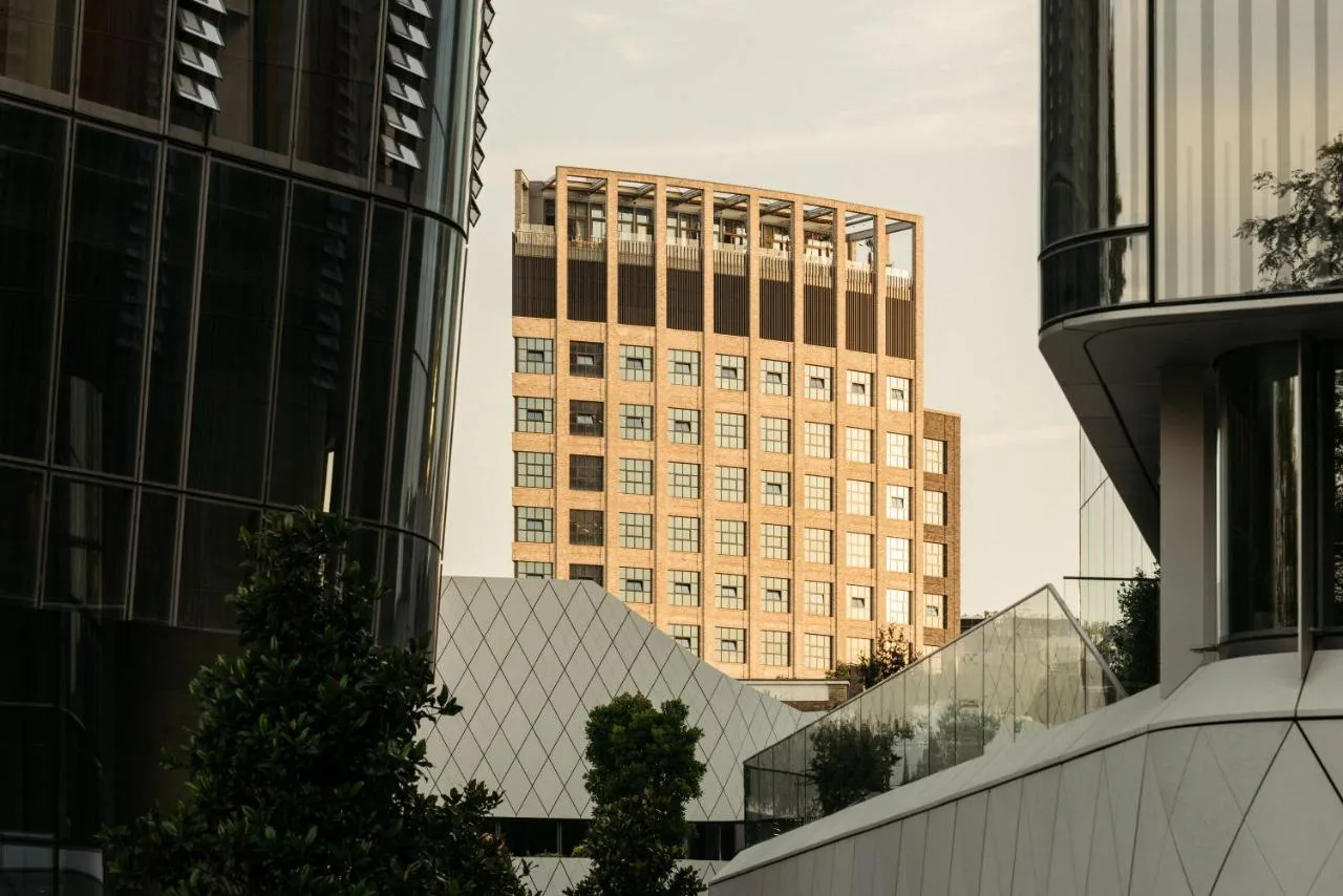 a tall building in the middle of a city at The Hoxton, Southwark in London