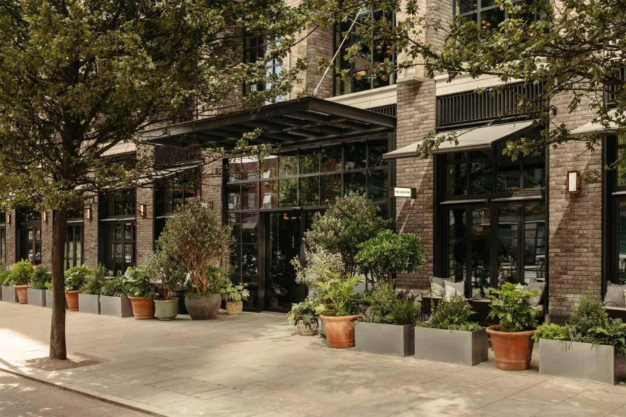 a building with potted plants in front of it at The Hoxton, Southwark in London